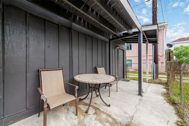 view of patio / terrace featuring fence