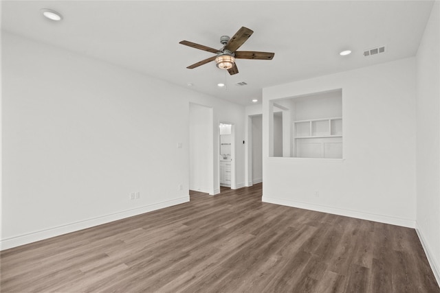 interior space featuring recessed lighting, a ceiling fan, visible vents, baseboards, and wood finished floors