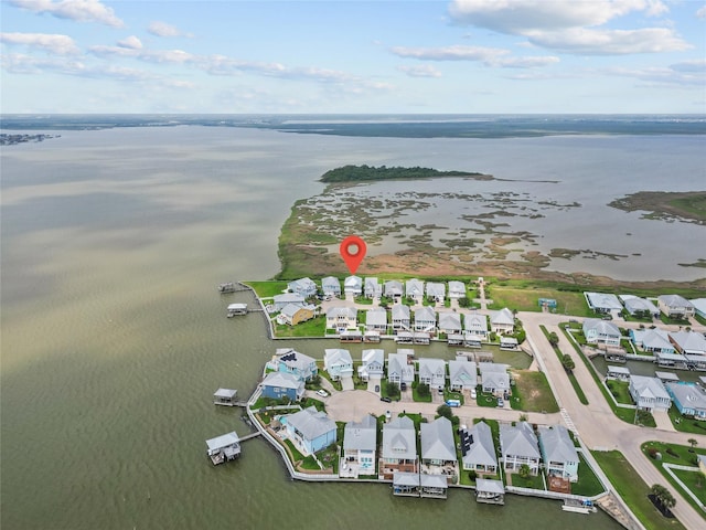 birds eye view of property featuring a residential view and a water view