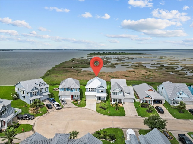 aerial view featuring a residential view and a water view
