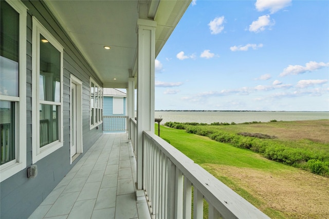 balcony featuring a water view