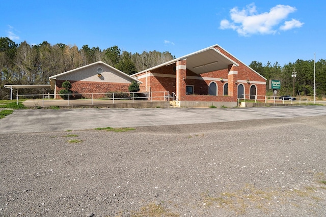 1561 US Highway 69 N, Woodville, TX 75979 - view of front of house featuring brick siding and fence