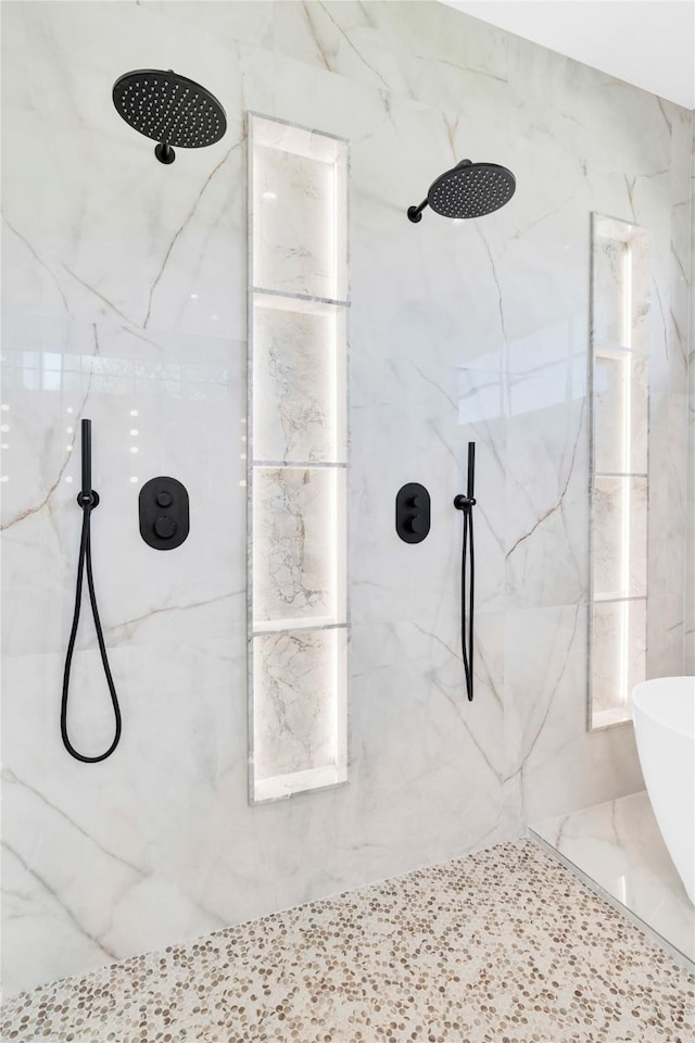 full bathroom featuring a marble finish shower
