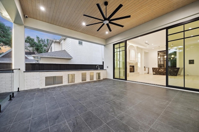 view of patio / terrace featuring visible vents, a ceiling fan, and a sink
