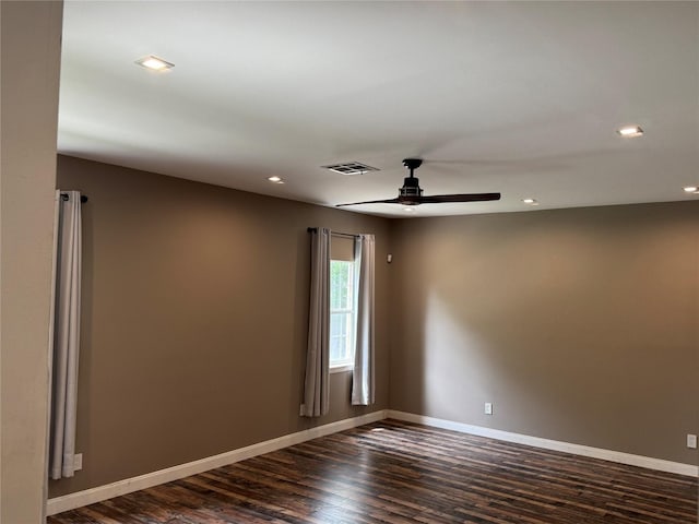 unfurnished room featuring dark wood finished floors, a ceiling fan, baseboards, recessed lighting, and visible vents