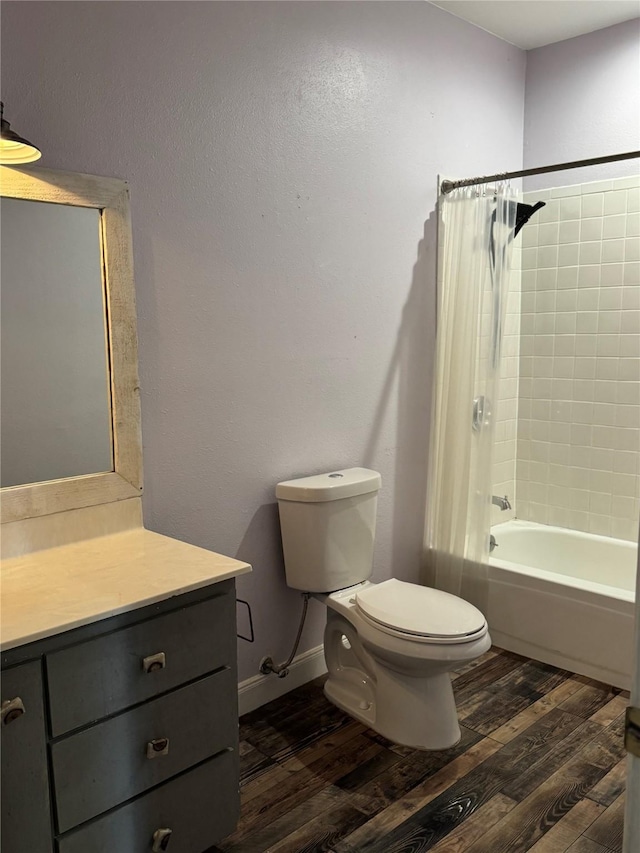 full bathroom with toilet, wood finished floors, and vanity