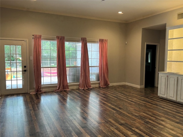 unfurnished living room featuring recessed lighting, baseboards, dark wood-style floors, and ornamental molding