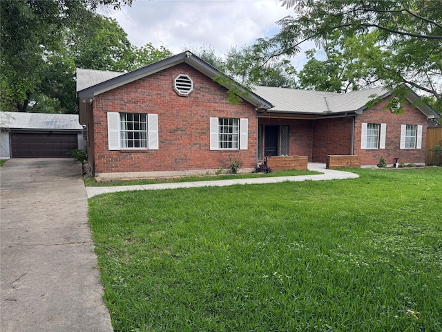 single story home with brick siding, a garage, a front yard, and metal roof