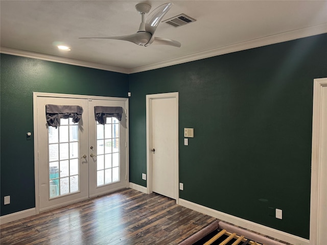 interior space featuring visible vents, ornamental molding, baseboards, dark wood-type flooring, and french doors