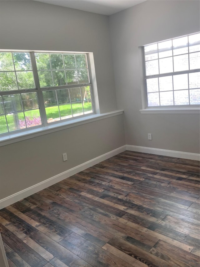 9010 Carousel Ln, Houston, TX 77080 - spare room with dark wood-style floors and baseboards