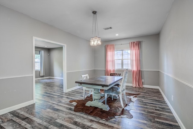9010 Carousel Ln, Houston, TX 77080 - dining room with wood finished floors, a chandelier, and recessed lighting