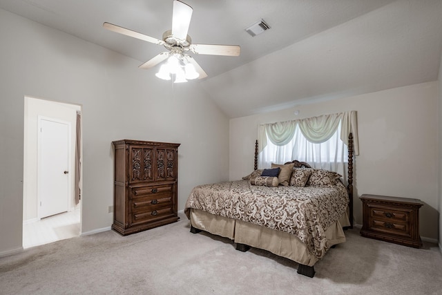 bedroom featuring ceiling fan, visible vents, vaulted ceiling, light carpet, and baseboards