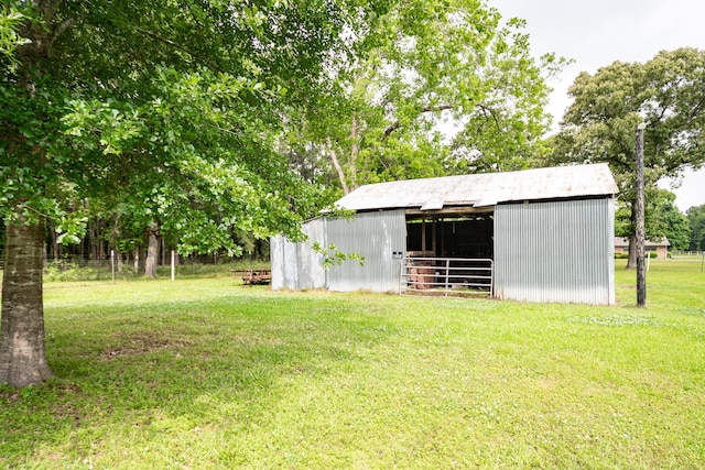 view of pole building with a lawn