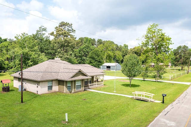 surrounding community featuring a lawn and fence