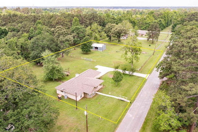 drone / aerial view featuring a view of trees