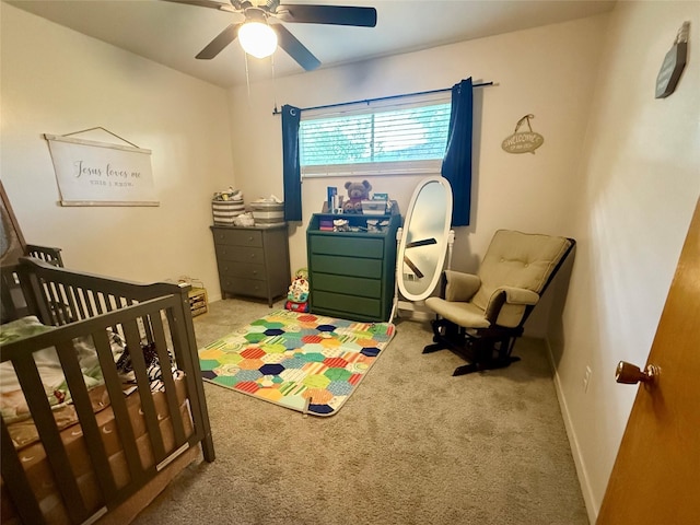 bedroom featuring ceiling fan and carpet