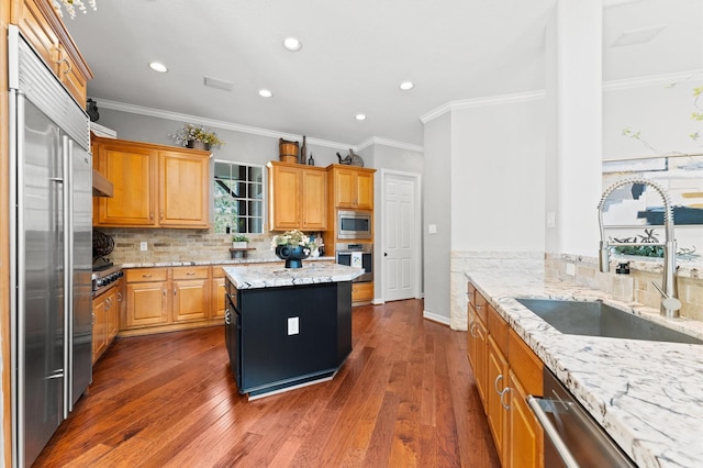 33802 Thousand Oaks Blvd, Magnolia, TX 77354 - kitchen with a sink, dark wood-style flooring, built in appliances, and backsplash