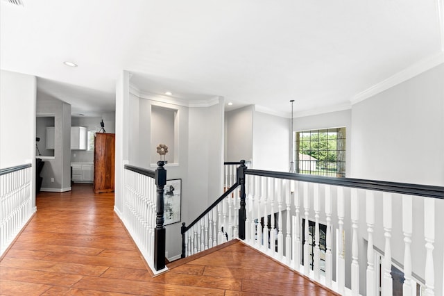 33802 Thousand Oaks Blvd, Magnolia, TX 77354 - hallway featuring wood finished floors, an upstairs landing, recessed lighting, crown molding, and baseboards