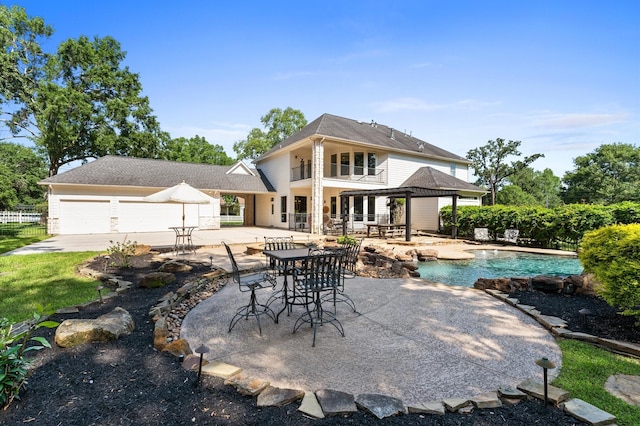 33802 Thousand Oaks Blvd, Magnolia, TX 77354 - back of house featuring a patio, a garage, fence, a gazebo, and an outdoor pool