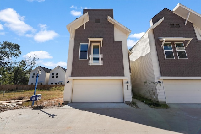 contemporary home with driveway and a garage