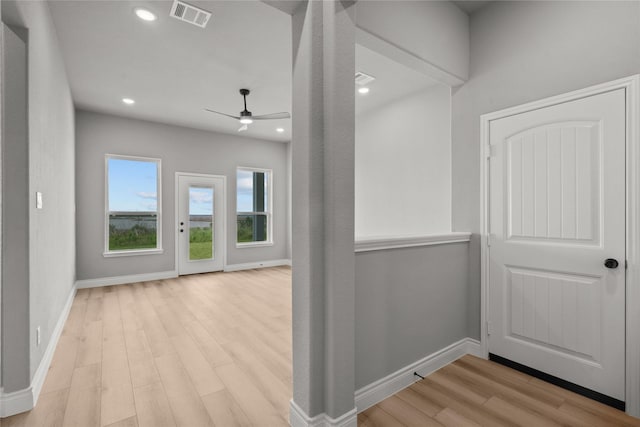 interior space with wood finished floors, visible vents, recessed lighting, and baseboards