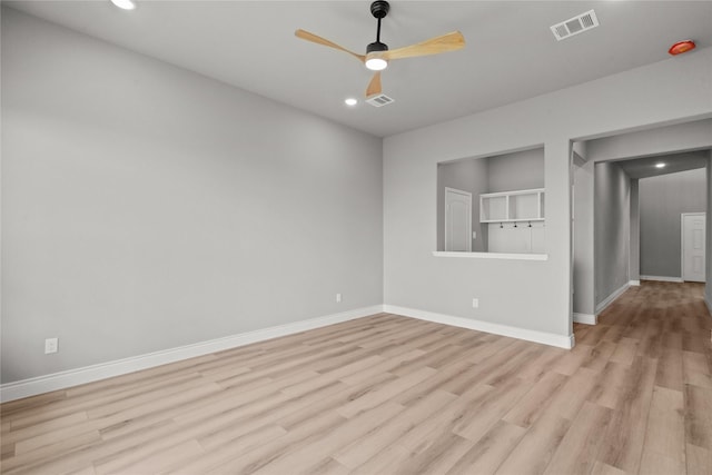 unfurnished room featuring recessed lighting, light wood-style flooring, ceiling fan, baseboards, and visible vents