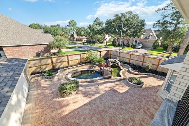 view of yard with a residential view, a patio, a jacuzzi, and fence