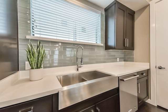 1812 Bingham St, Houston, TX 77007 - kitchen featuring dark brown cabinetry, backsplash, light countertops, and a sink
