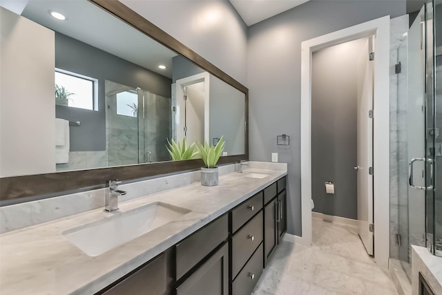 1812 Bingham St, Houston, TX 77007 - full bathroom with a stall shower, marble finish floor, double vanity, and a sink