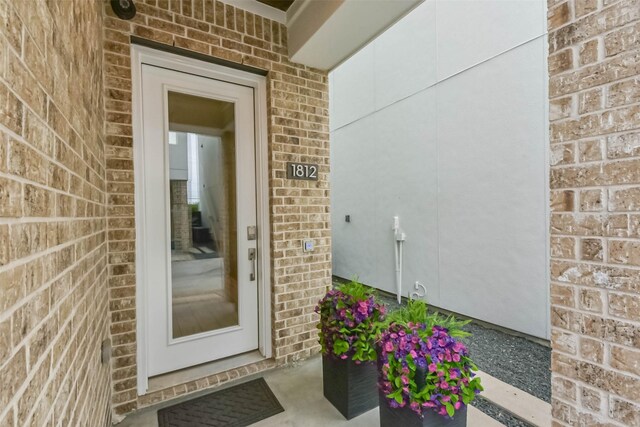 1812 Bingham St, Houston, TX 77007 - doorway to property featuring brick siding