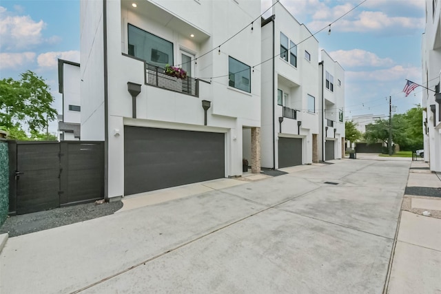 1812 Bingham St, Houston, TX 77007 - exterior space with a garage, stucco siding, and concrete driveway