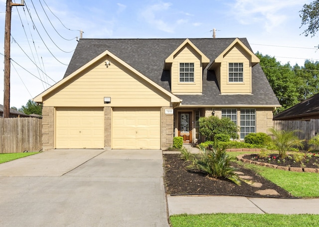 7918 Winehill Ln, Houston, TX 77040 - view of front of home featuring an attached garage, a shingled roof, driveway, and brick siding