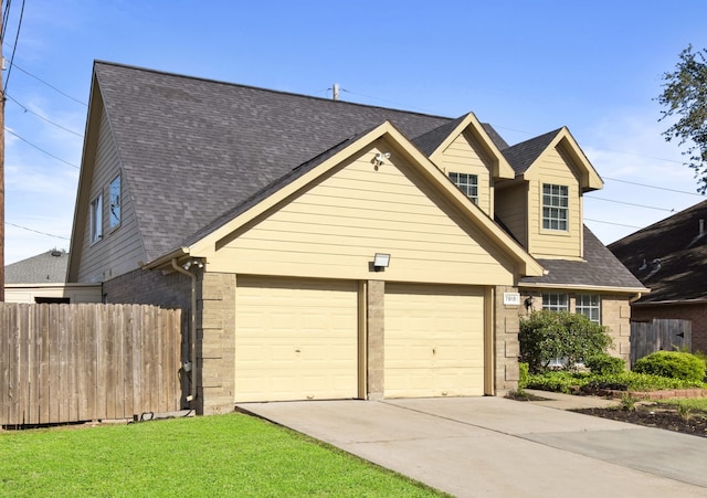 view of front of home featuring a garage, driveway, brick siding, roof with shingles, and fence