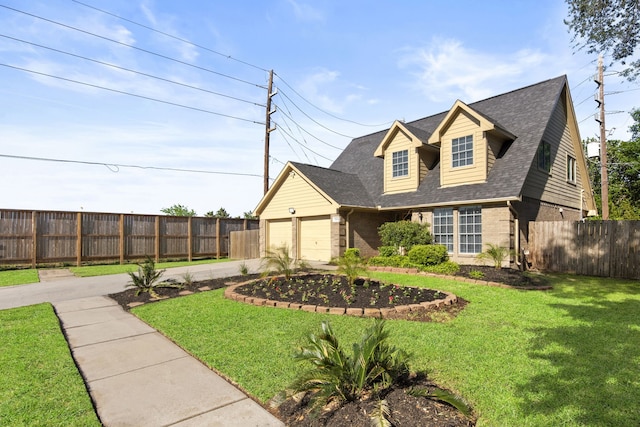 new england style home with concrete driveway, fence, a front lawn, and brick siding