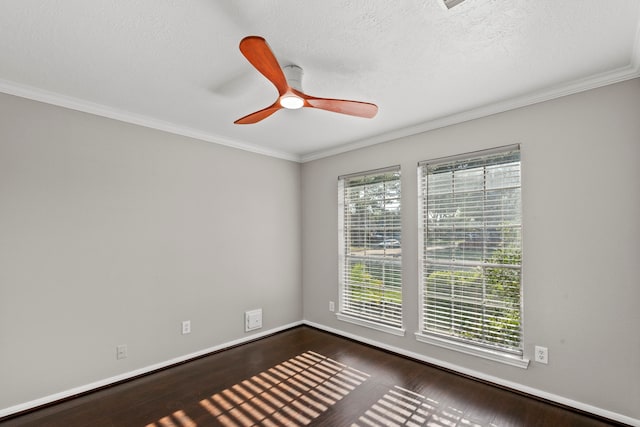 unfurnished room with ornamental molding, a ceiling fan, baseboards, and dark wood-type flooring