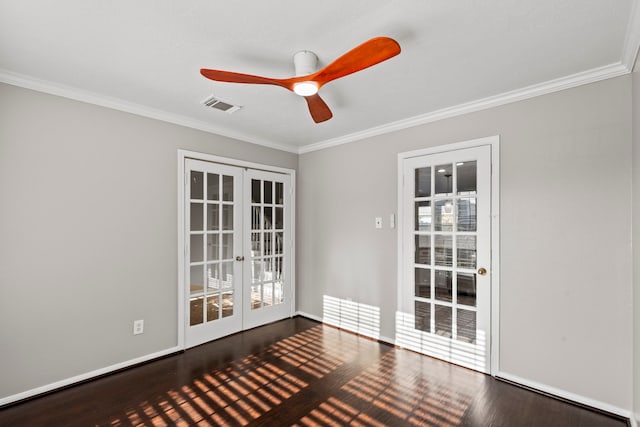empty room featuring visible vents, ceiling fan, wood finished floors, and french doors