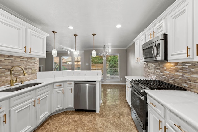 kitchen with white cabinetry, stainless steel appliances, crown molding, and a sink
