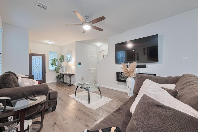 4807 Purple Wisteria Ln, Spring, TX 77373 - living room with ceiling fan, light wood-style flooring, and baseboards