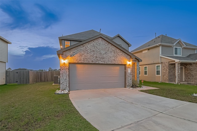 4807 Purple Wisteria Ln, Spring, TX 77373 - traditional home featuring brick siding, a garage, concrete driveway, and central AC