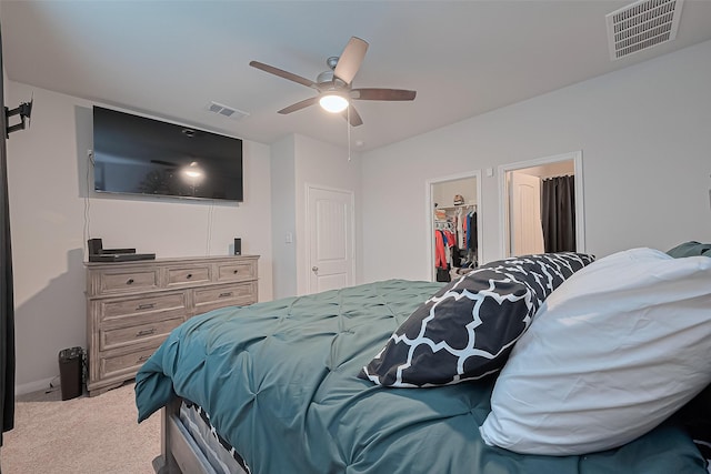 4807 Purple Wisteria Ln, Spring, TX 77373 - carpeted bedroom with a spacious closet, a ceiling fan, and a closet