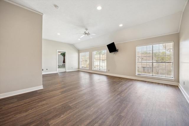 unfurnished living room with vaulted ceiling, ornamental molding, ceiling fan, baseboards, and dark wood-style floors