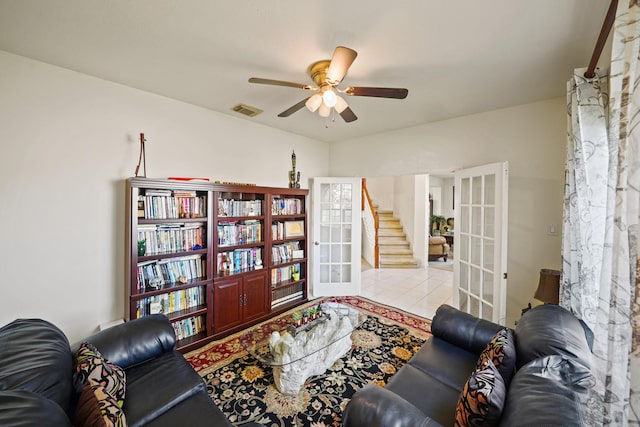13823 Eldridge Garden Cir, Houston, TX 77083 - tiled living room featuring a ceiling fan, stairs, french doors, and visible vents