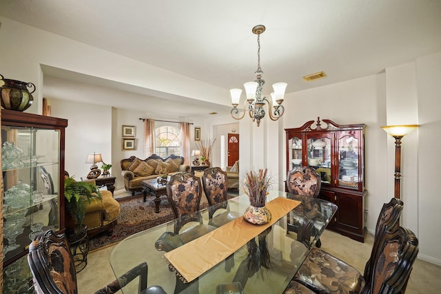 13823 Eldridge Garden Cir, Houston, TX 77083 - dining area with light colored carpet, an inviting chandelier, and visible vents