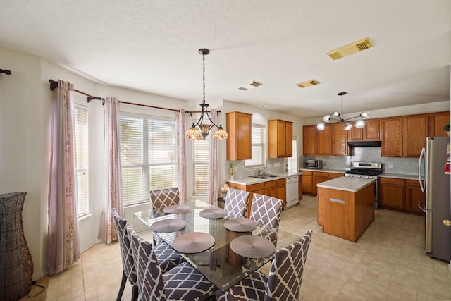 13823 Eldridge Garden Cir, Houston, TX 77083 - dining space featuring light floors, a chandelier, and visible vents