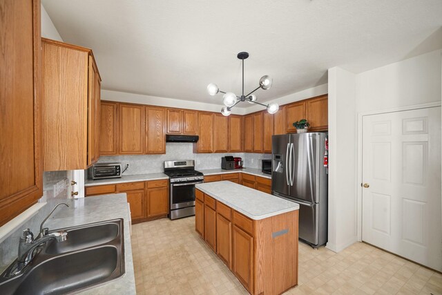 13823 Eldridge Garden Cir, Houston, TX 77083 - kitchen featuring a sink, stainless steel appliances, light floors, under cabinet range hood, and light countertops