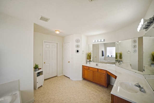 13823 Eldridge Garden Cir, Houston, TX 77083 - full bath featuring visible vents, a bath, a sink, tile patterned floors, and two vanities