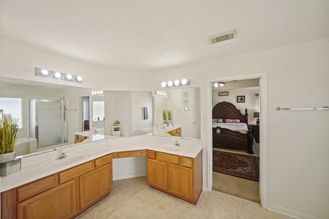 13823 Eldridge Garden Cir, Houston, TX 77083 - bathroom featuring a sink, connected bathroom, a stall shower, and visible vents