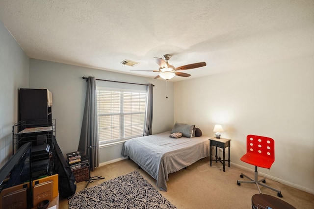 13823 Eldridge Garden Cir, Houston, TX 77083 - bedroom with carpet, a textured ceiling, visible vents, baseboards, and ceiling fan