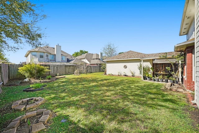 13823 Eldridge Garden Cir, Houston, TX 77083 - view of yard featuring an outdoor fire pit and a fenced backyard