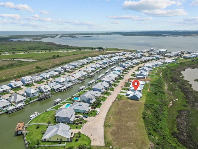 bird's eye view with a water view and a residential view